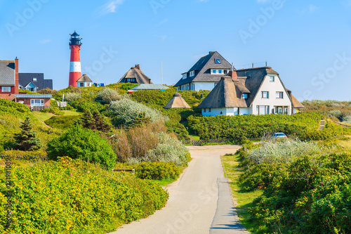 Road to lighthouse in Hornum village on southern coast of Sylt island, Germany photo