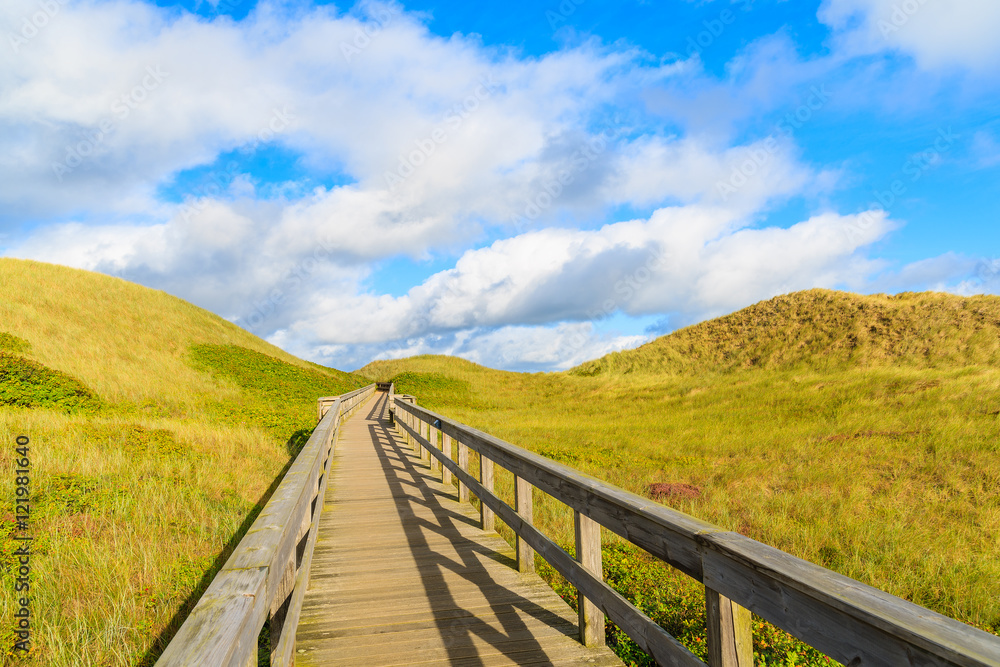 Wooden walkway to beach among sand dunes on Sylt island, Germany