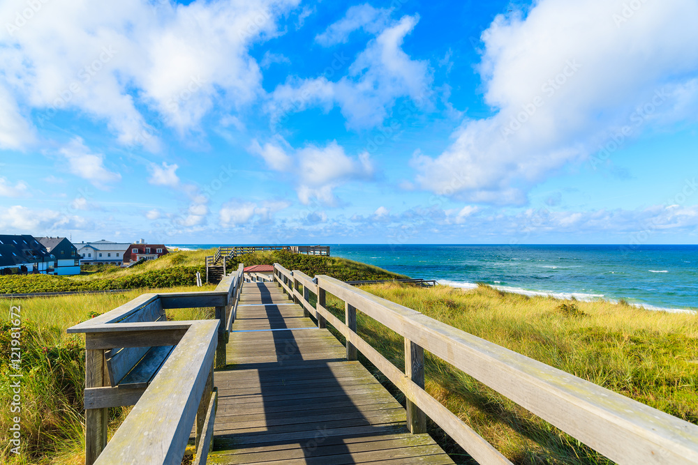 Wooden walkway along a coast and beach view in Wenningstedt, Sylt island, Germany