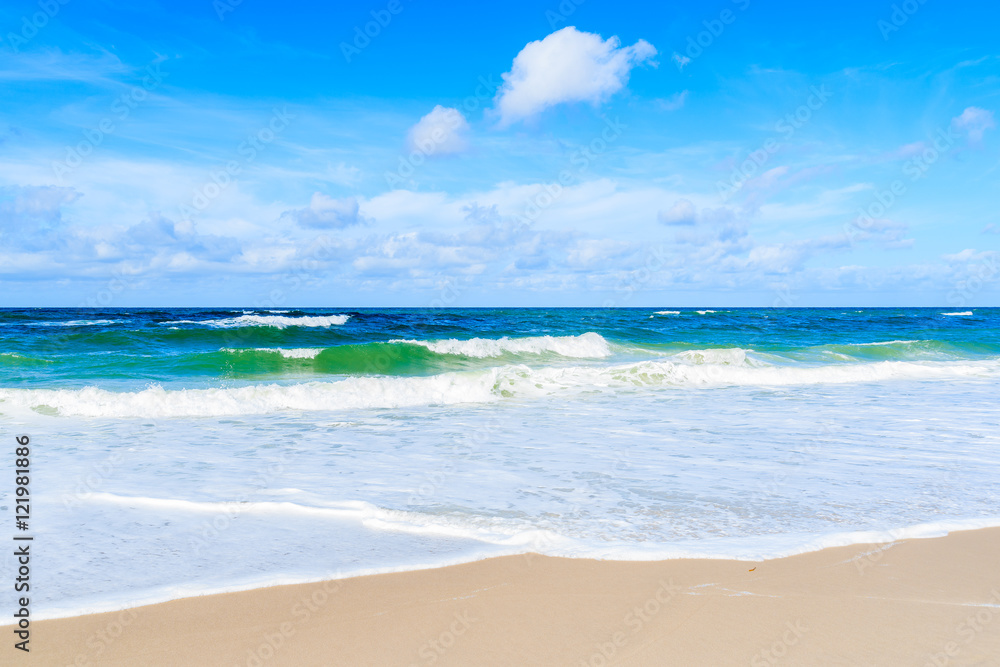 Sea waves on sandy beach, Sylt island, Germany Sea waves on sandy beach, Sylt island, Germany