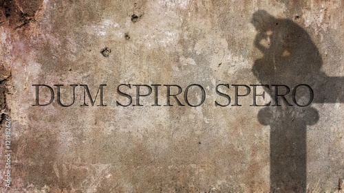 Dum spiro spero. A Latin phrase that means means While I breathe, I hope. photo
