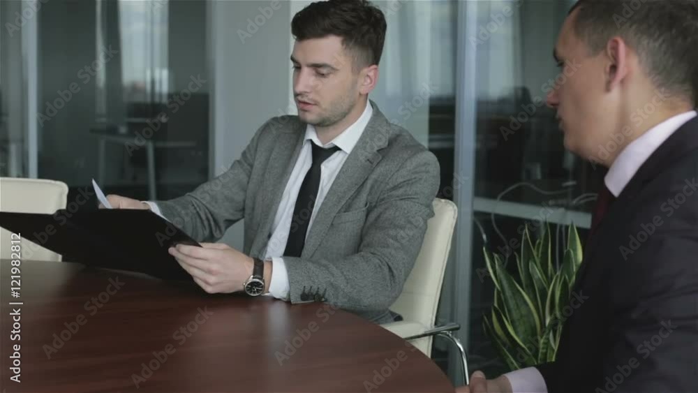 The lawyer working with the client. The lawyer working with the client.