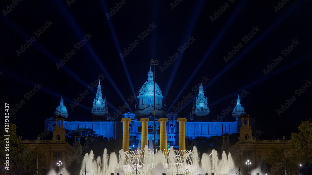 Naklejka premium Barcelona, Spain. Magic Fountain of Montjuic laser and water show at night. The fountain is located close to Plaza de Espana. Light show is accompanied by music some nights of the week. 