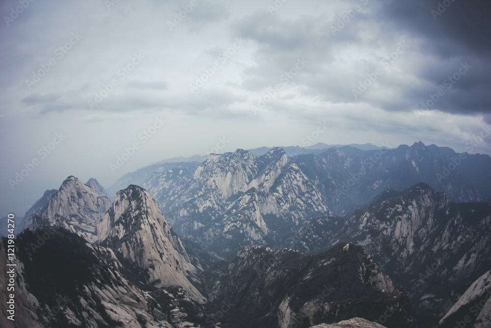 Mystic foggy mountain landscape in the clouds.