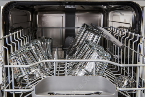 Clean transparent glasses in modern dishwasher machine