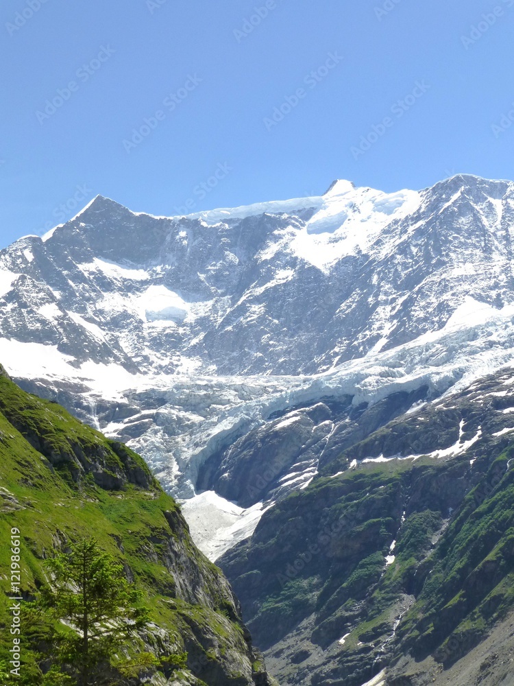 Snow covered peaks and glacier seen from the Pfingstegg mountain path, Switzerland 