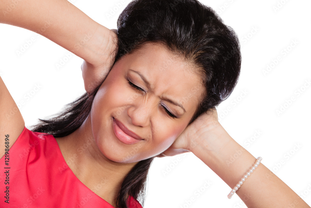 Naklejka premium Mixed race woman closing ears with hands.