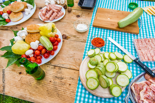 Table with food and drink ready for barbecue party