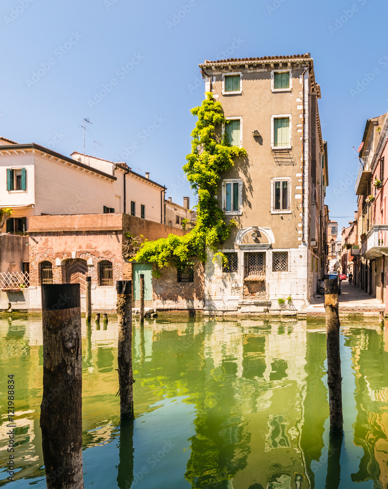 Chioggia houses create colorful reflections in the water of the