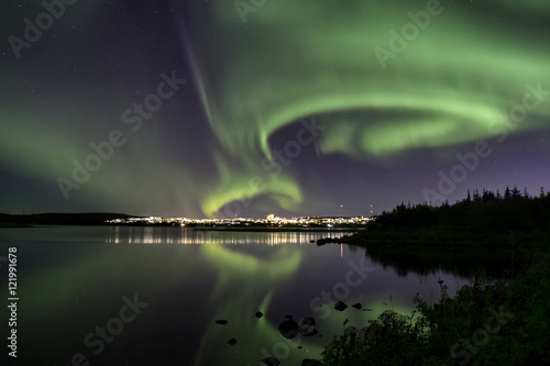 Aurora over Reykjavik city