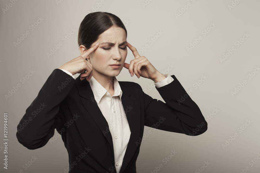 Close up beautiful woman with headache isolated studio shot Close up beautiful woman with headache isolated studio shot