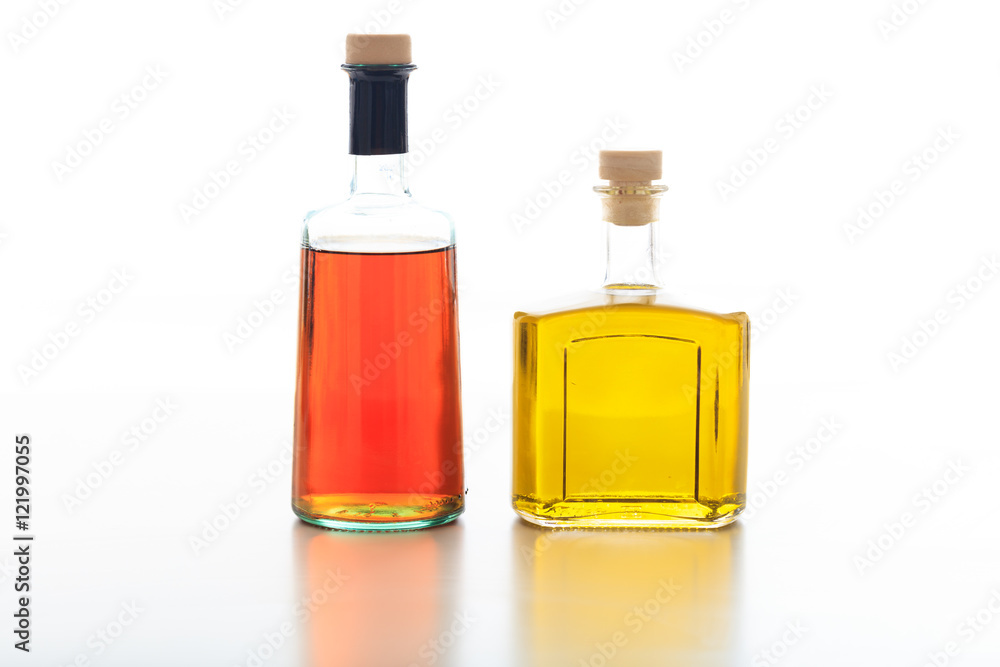 Olive oil and vinegar on white background Olive oil and vinegar on white background