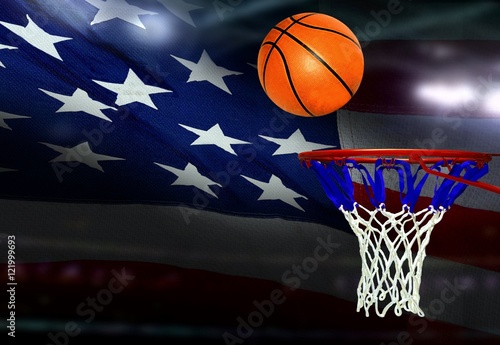 Basketball shot to the hoop with American flag background © razihusin