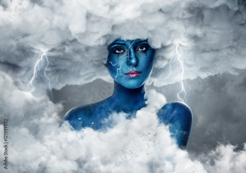 Fototapeta Naklejka Na Ścianę i Meble -  Female with blue skin in an arch of white clouds.
