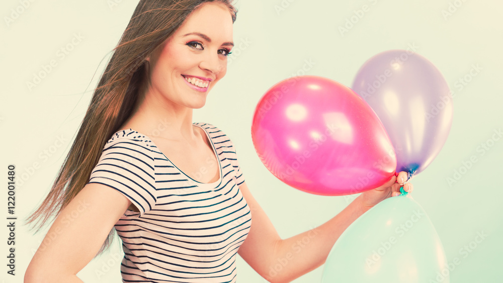Woman summer joyful girl with colorful balloons Woman summer joyful girl with colorful balloons