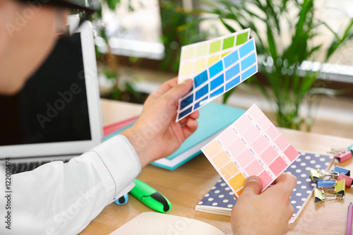 Man holding colour palette ...