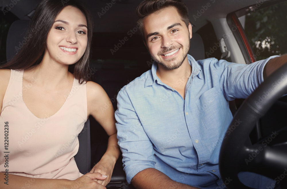 Beautiful young couple in car Beautiful young couple in car
