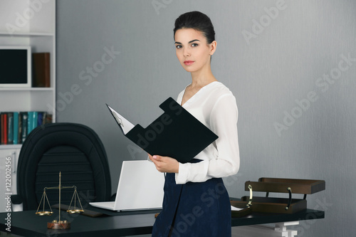 Beautiful young woman worki...