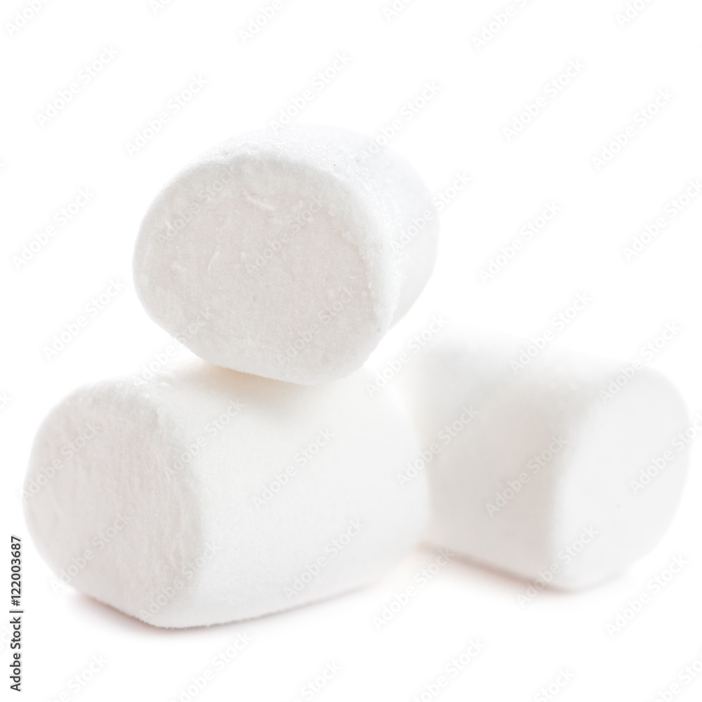 Fluffy white marshmallow macro isolated over white background. H Fluffy white marshmallow macro isolated over white background. H