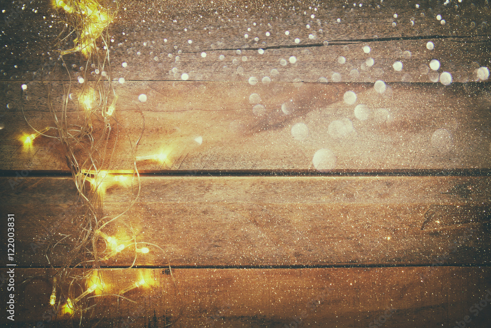 Christmas gold garland lights on wooden rustic background
