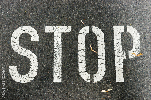 Stop sign on city asphalt o...