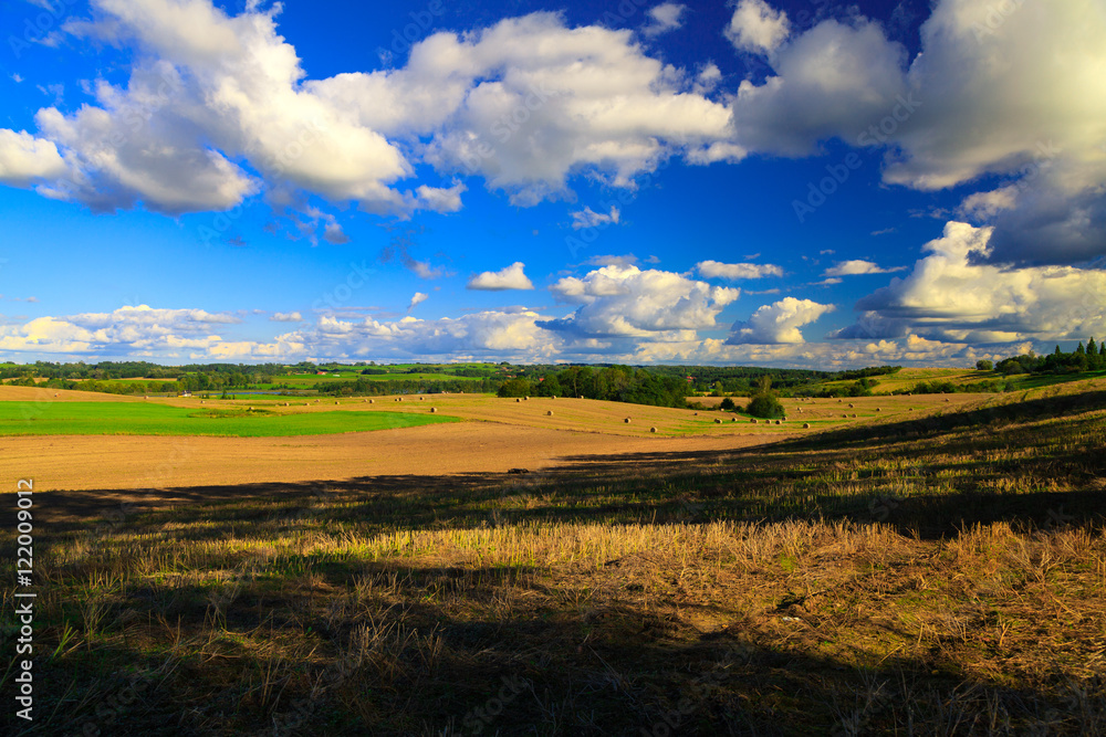 Beautiful landscape with snopkami straw on the field.
