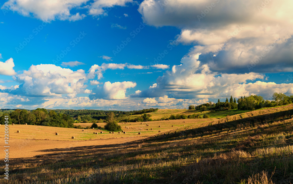 Beautiful landscape with snopkami straw on the field.