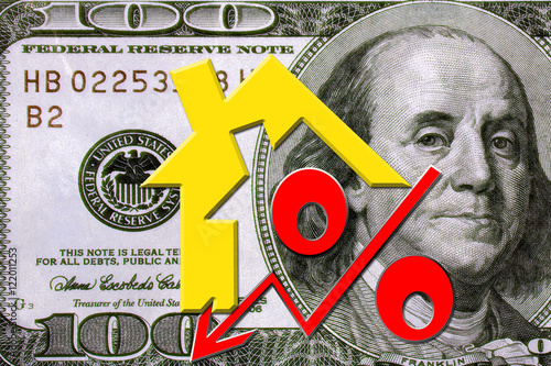 Red percent sign on a background of money . The concept of price changes on the real estate market