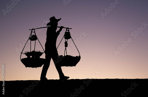 silhouette of Asian man peddler hawker
