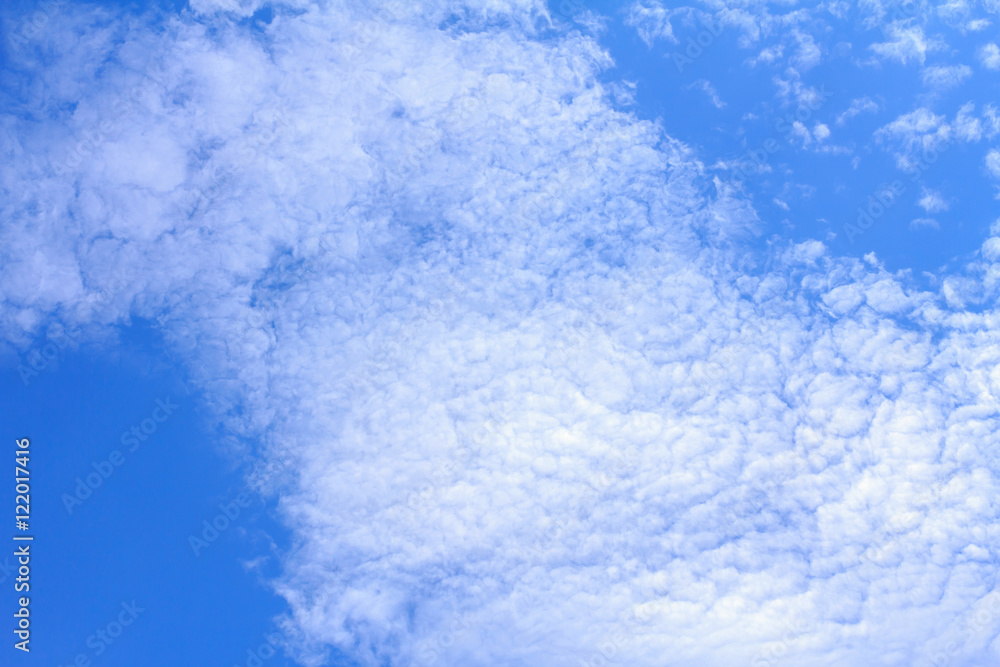 Fototapeta premium Blue sky background with white clouds. The vast blue sky and clouds sky on sunny day. White fluffy clouds in the blue sky.