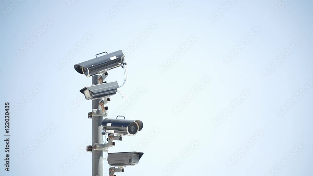 Many surveillance cams on a pole, watching the neighbors. Harsh colors, slow zoom in movement.
Many surveillance cams on a pole, watching the neighbors. Harsh colors, slow zoom in movement.