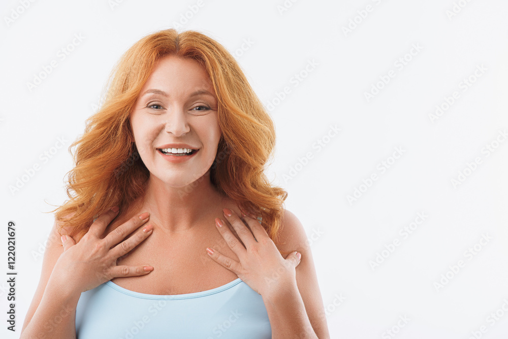 Excited middle-aged lady evincing her joy Excited middle-aged lady evincing her joy