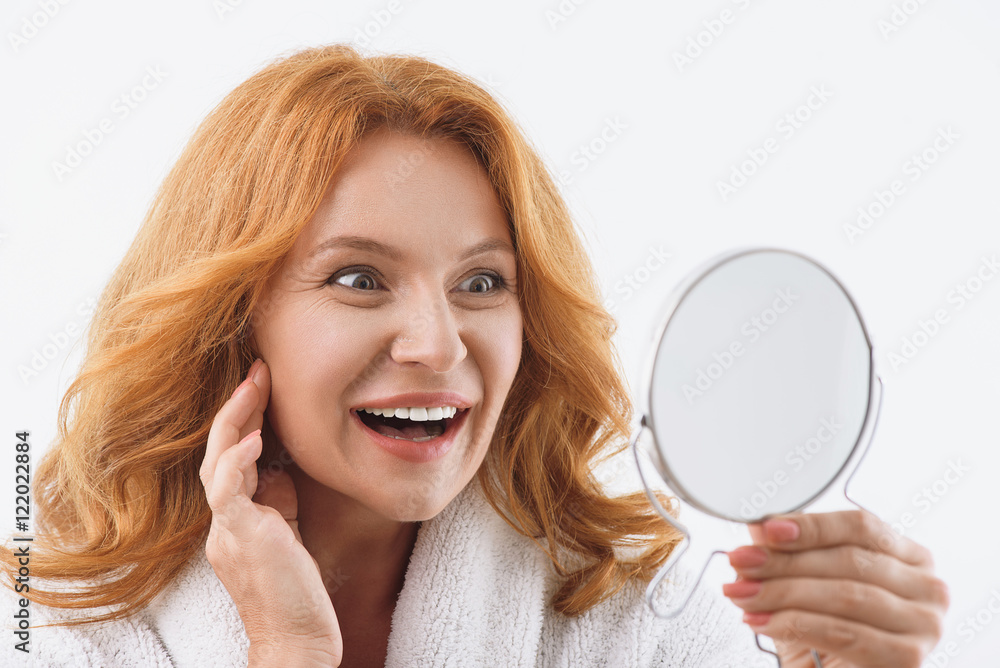 Pretty middle-aged lady caring of her appearance Pretty middle-aged lady caring of her appearance