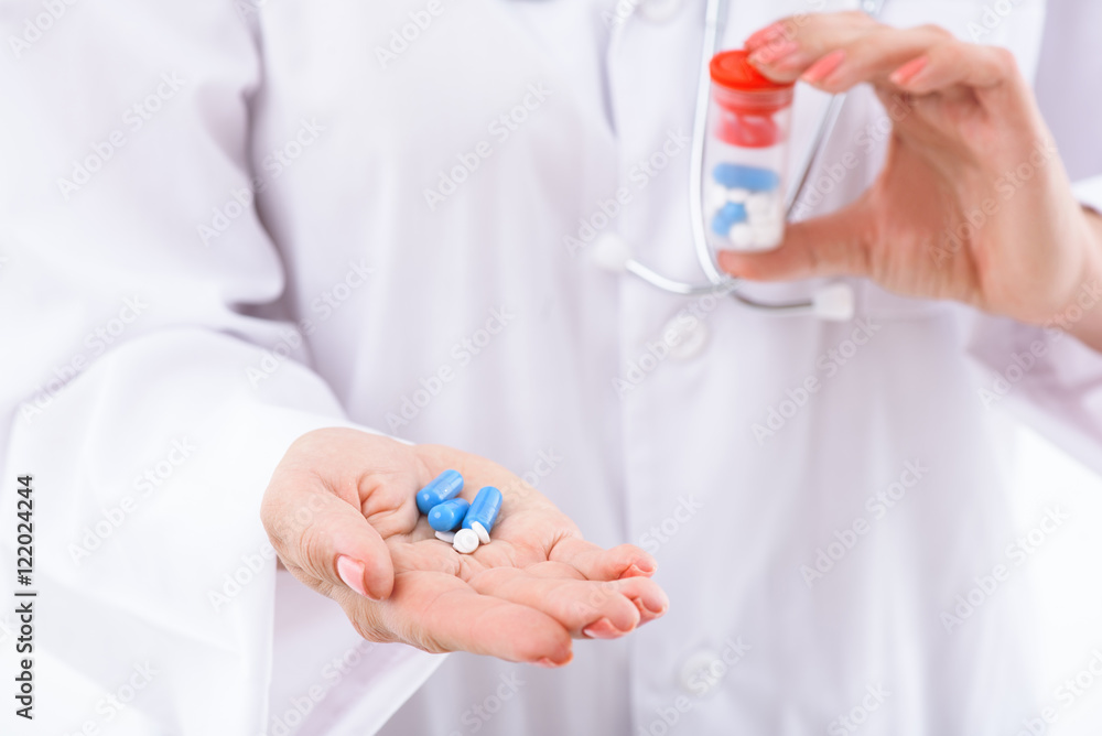 General practitioner showing various medication General practitioner showing various medication