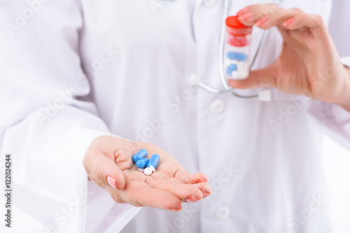 General practitioner showing various medication