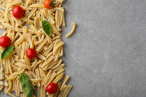 pasta background with tomato and basil