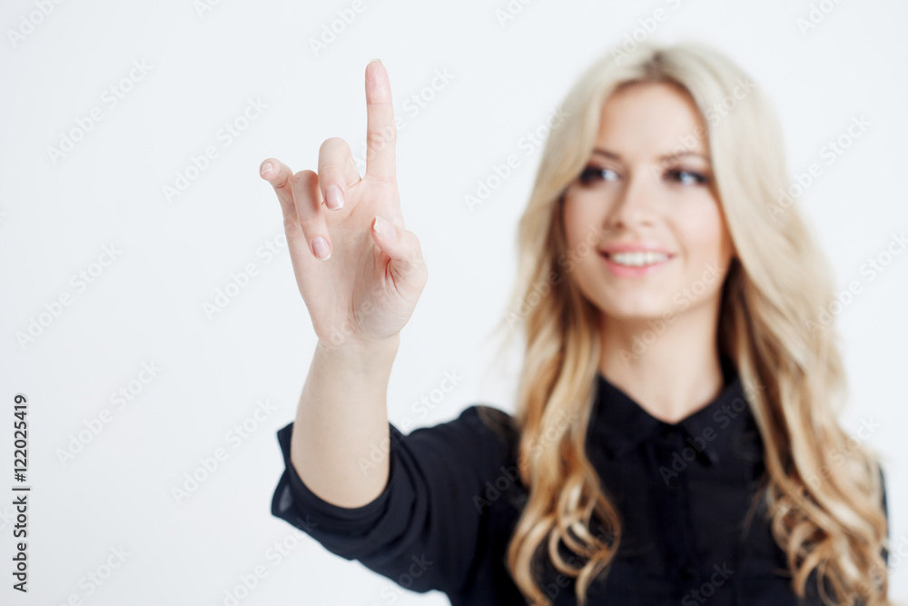 Confident business lady, touching finger to screen, touching digital screen with finger, place for your text or design. Focus on hand Confident business lady, touching finger to screen, touching digital screen with finger, place for your text or design. Focus on hand