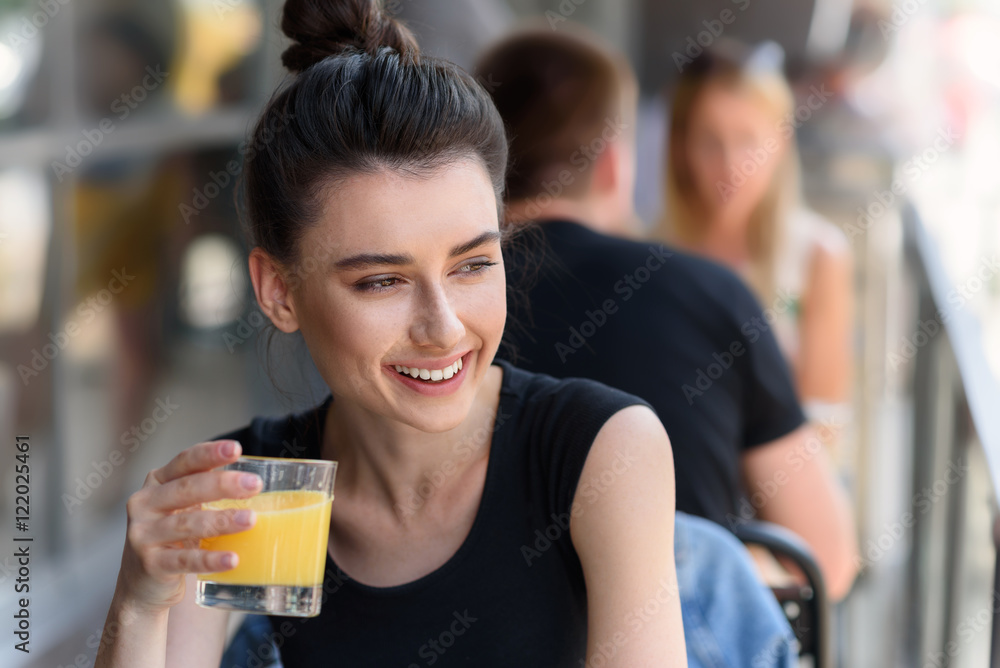 pretty lady holding glass of lemonade