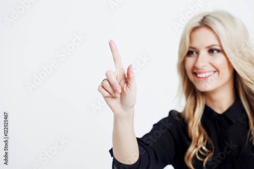 Wallpaper Mural Confident business lady, touching finger to screen, touching digital screen with finger, place for your text or design. Focus on hand Torontodigital.ca