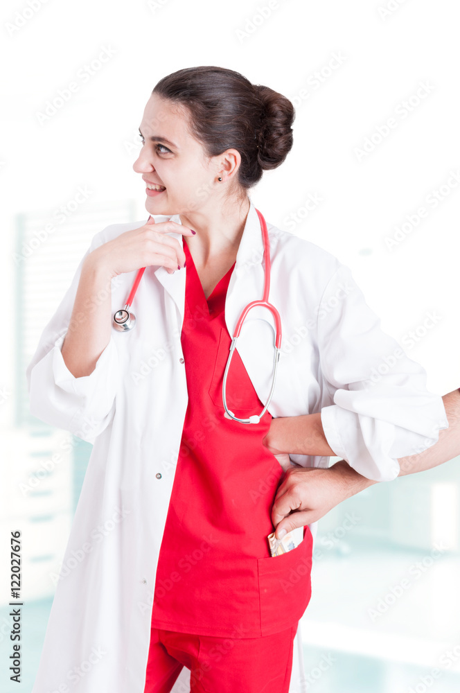 Female doctor getting money from male patient Female doctor getting money from male patient