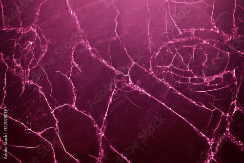 Cracked wooden wall with purple paint, abstract background