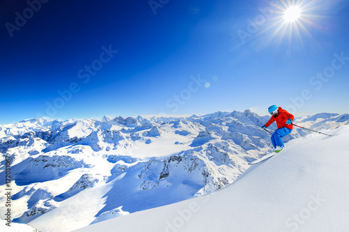 Skiing with amazing view of swiss famous mountains in beautiful photo