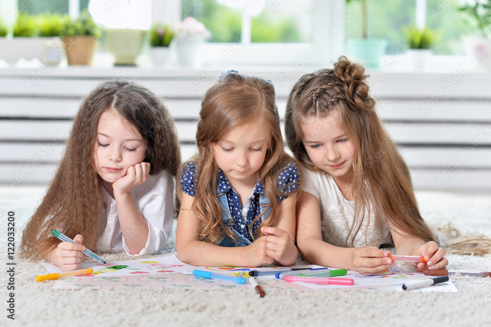 Fototapeta premium Portrait of Little girls drawing