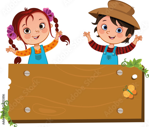 Happy two farm children with a blank wooden sign.