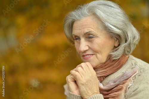 senior woman in autumn park