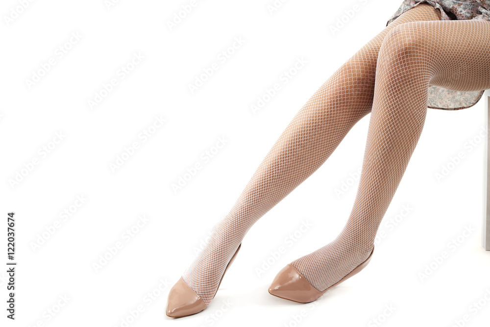 Woman legs wearing high heels  on white background