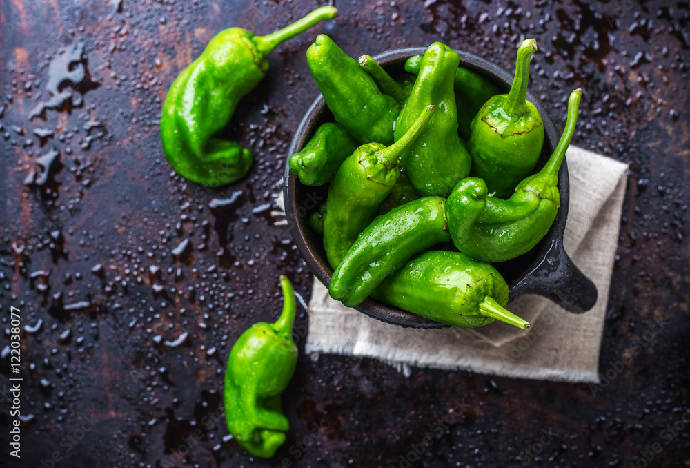 Raw green peppers jalapeno pimientos de padron traditional spanish tapas  Stock Photo | Adobe Stock