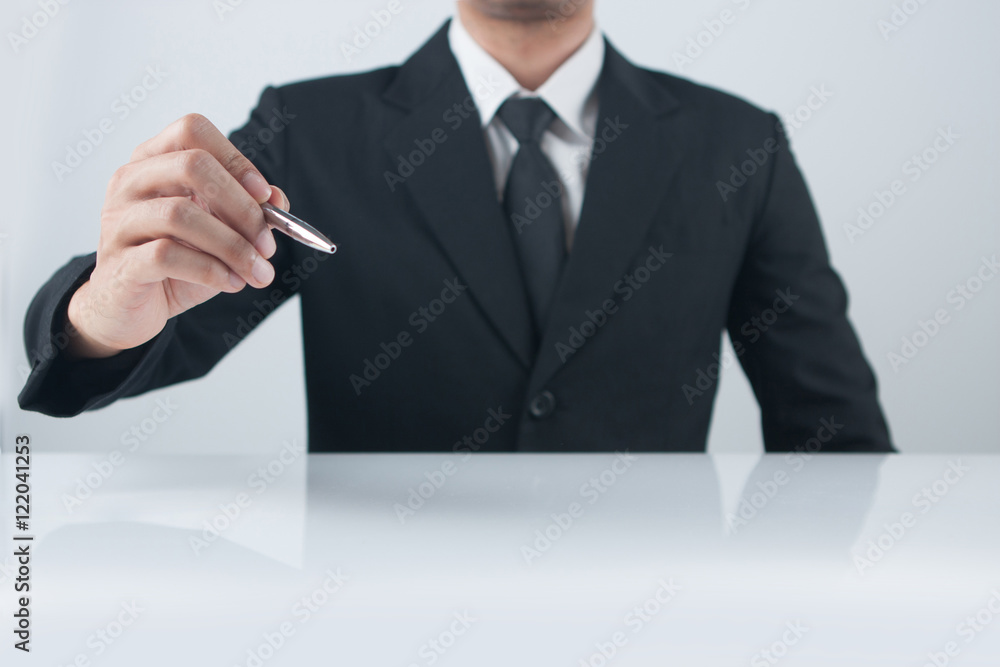 Businessman pressing an imaginary button Businessman pressing an imaginary button
