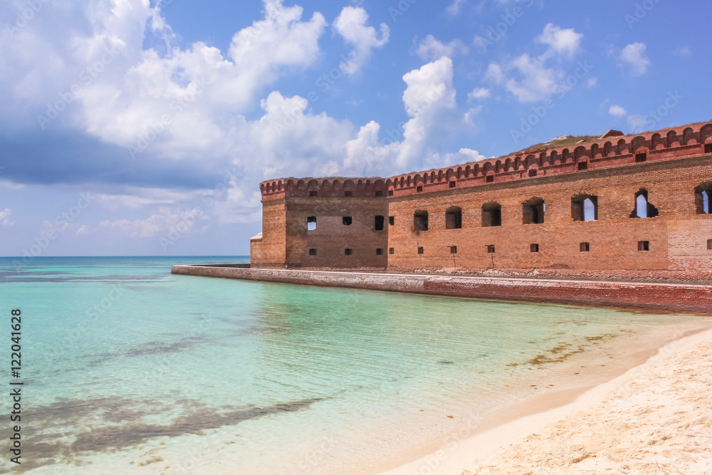 The crystal clear waters of the Gulf of Mexico surround Civil War Historic Fort Jefferson in the Dry Tortugas National Park known for its famous bird and marine life.