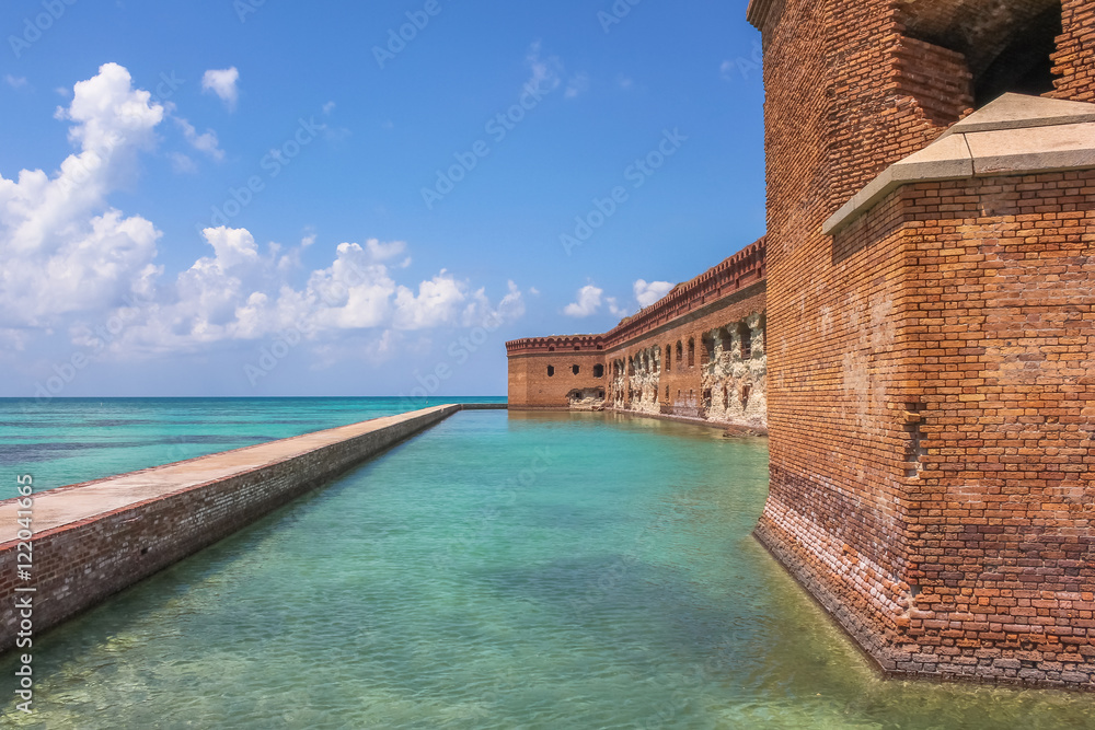 Northern Side of Fort Jefferson on Dry Tortugas National Park, Florida. The brick moat around Fort Jefferson with the crystal clear waters of the Gulf del Messico surround it.